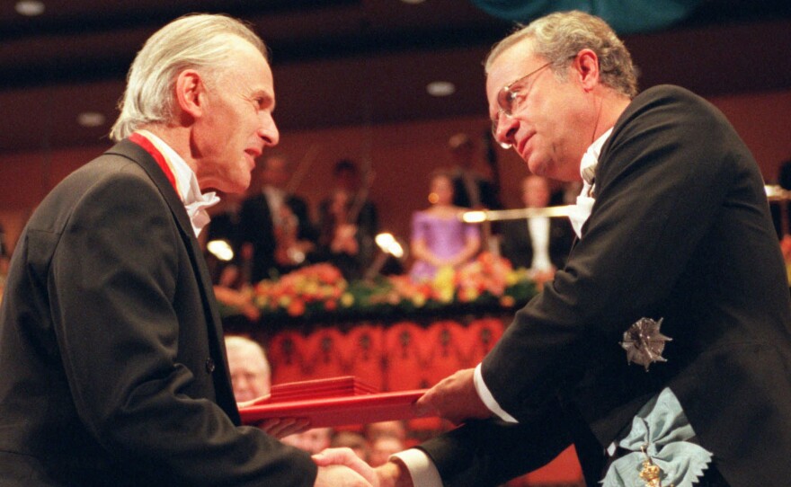 Sir Harold W. Kroto (left) received the Nobel prize in chemistry from Swedish King Carl XVI Gustaf in Stockholm, in 1996.