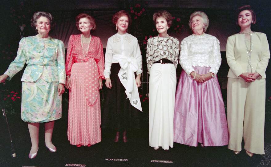 Former first ladies Lady Bird Johnson, Betty Ford, Rosalynn Carter, Nancy Reagan, Barbara Bush and first lady Hillary Clinton stand on stage, on May 11, 1994, during a gala event in their honor at the Botanic Garden Conservatory in Washington.