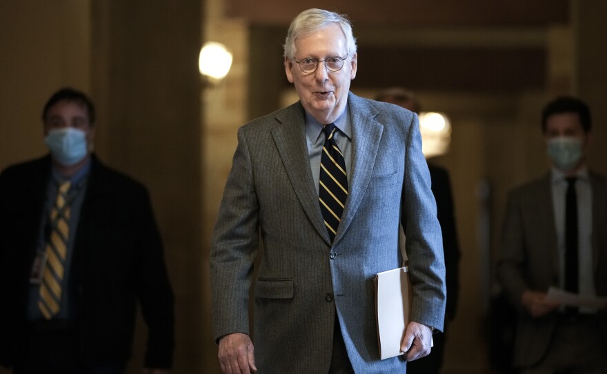 Senate Minority Leader Mitch McConnell, R-Ky., walks to the Senate floor at the U.S. Capitol on Wednesday. McConnell says he may be open to reforming the Electoral Count Act.