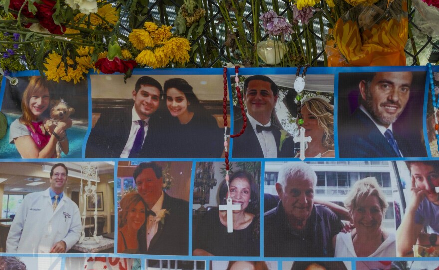 A memorial shows some of the people still missing from the Champlain Towers South condo collapse in Surfside, Fla.