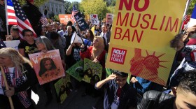  In this Oct. 18, 2017, file photo, protesters gather at a rally in Washington. The Supreme Court is allowing the Trump administration to fully enforce a ban on travel to the United States by residents of six mostly Muslim countries. 