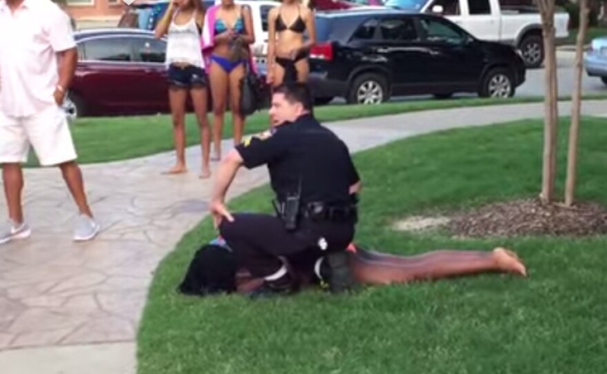 A still from a video showing Cpl. Eric Casebolt forcing a teenager to the ground in McKinney, Texas. Casebolt has resigned as an investigation continues.
