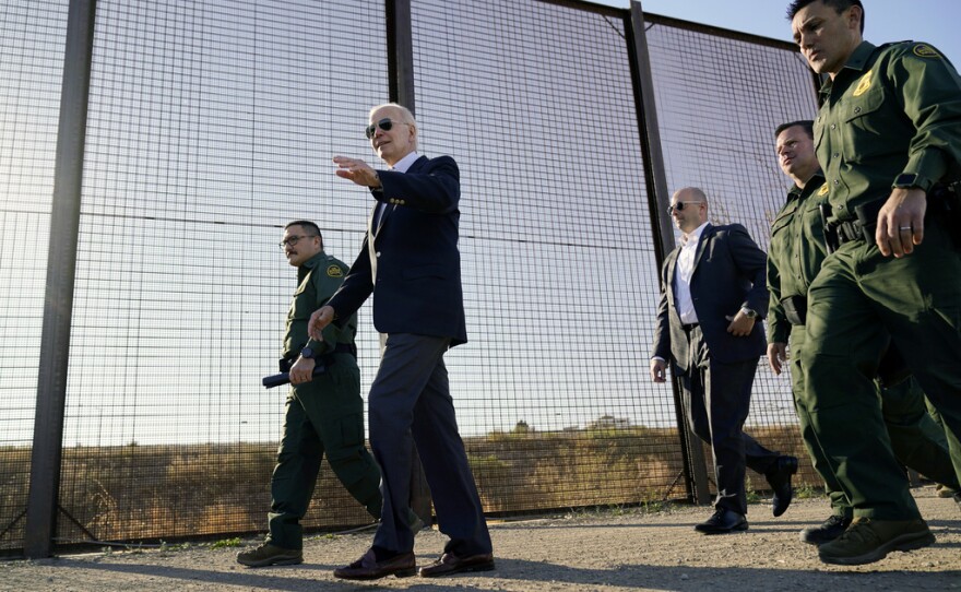 FILE - President Joe Biden walks along a stretch of the U.S.-Mexico border in El Paso Texas, Jan. 8, 2023. The Biden administration has requested 1,500 troops for the U.S.-Mexico border amid an expected migrant surge following the end of pandemic-era restrictions.