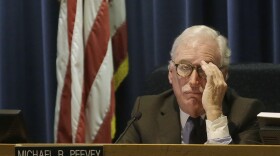 Michael Peevey listens to public comment during a meeting in San Francisco, Dec. 18, 2014.