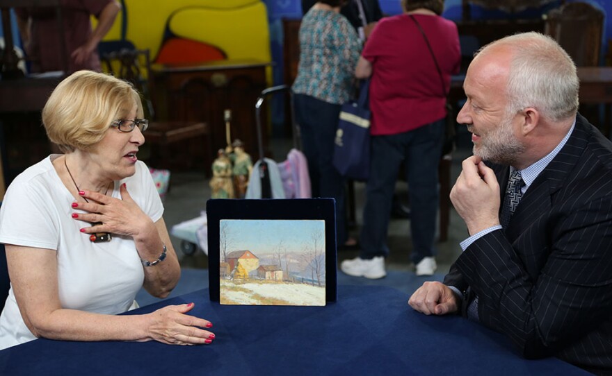 Alasdair Nichol (right) appraises a 1953 Kenneth Nunamaker "Bill's Place" oil in Detroit, Mich. ANTIQUES ROADSHOW “Best Bargains” premieres Monday, Oct. 18, 2021 at 8/7C p.m. on PBS. 