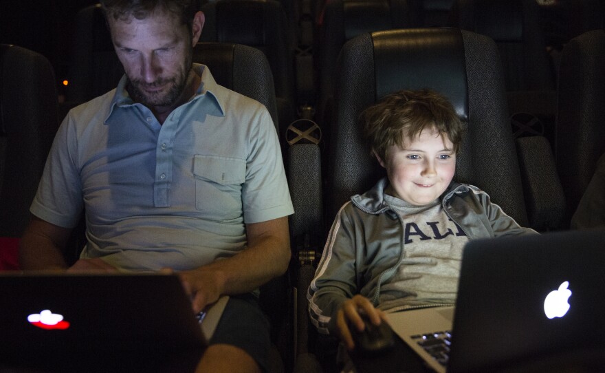 Jon Ogilvy plays Minecraft with his son, Nathaniel, 9. Jon said he hasn't played the game in awhile. "I'm a little rusty," Jon said. "He's a noob," Nathaniel responded.