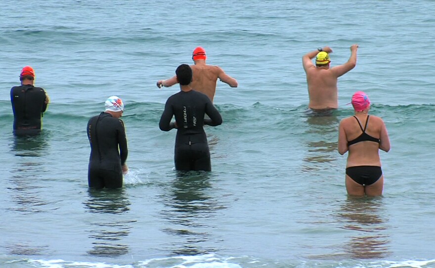 Swimmers at a Triathlon Club of San Diego meeting get in the ocean at La Jolla Shores on June 9, 2014.