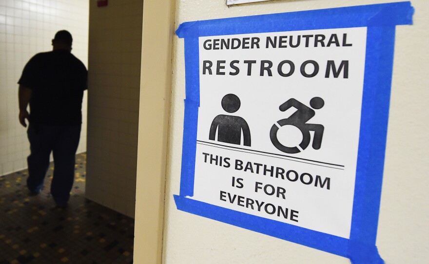 Signs are posted outside Santee High School's gender neutral restrooms at its campus in Los Angeles on May 4.