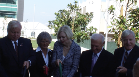Supervisors Bill Horn Diane Jacobs, Pam Slater-Price, Ron Roberts and Greg Cox line up to cut the ribbon on the county's new operations center.