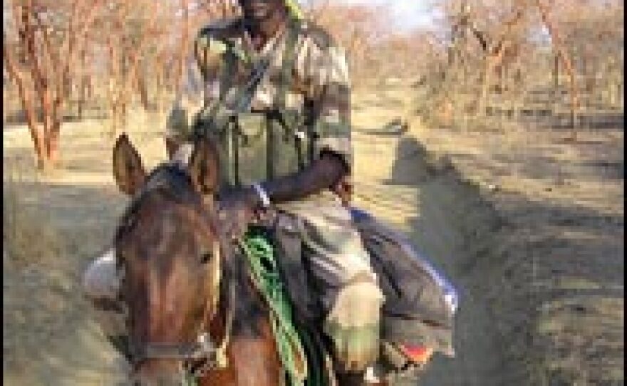 A Chadian government soldier rides from his base near the border with Sudan.