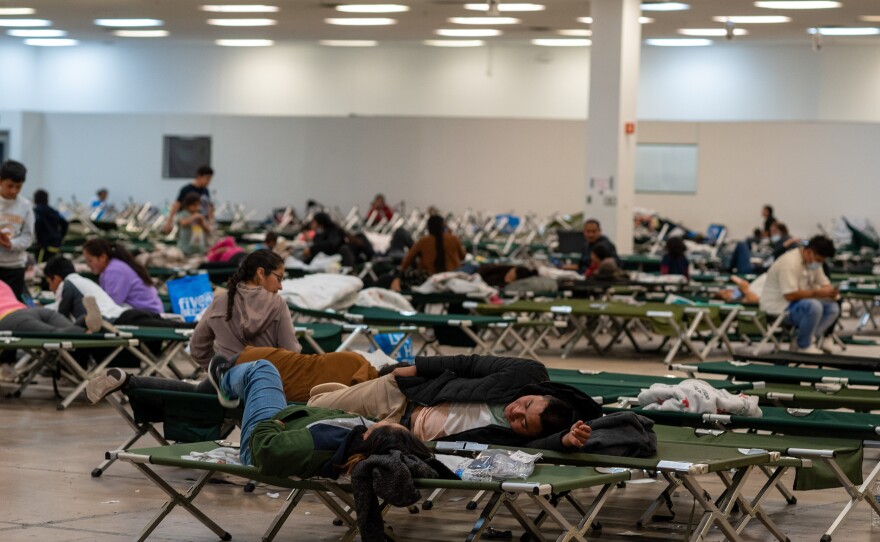 Asylum seekers lay down on cots while in Casa Alitas, a temporary shelter.