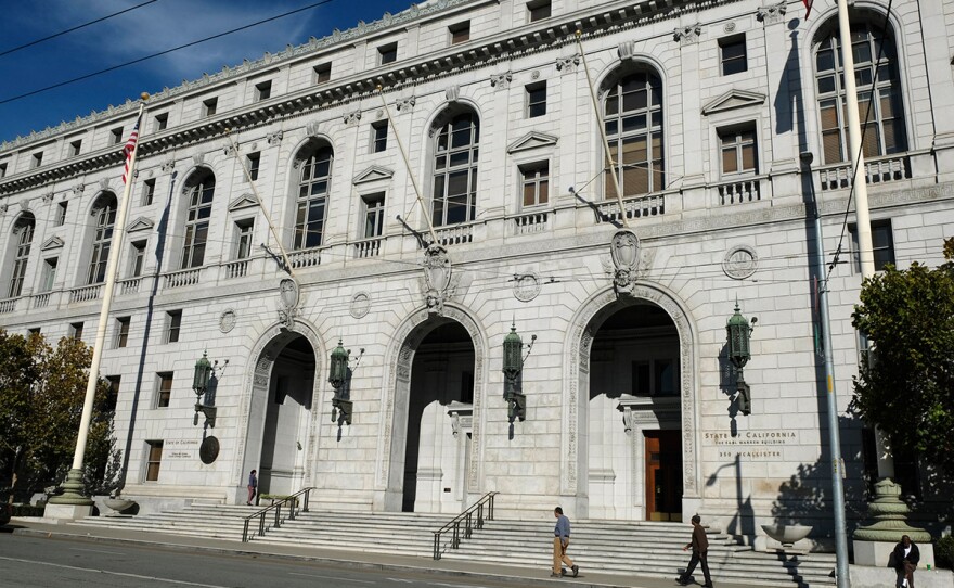  In this Nov. 2, 2018, file photo, people walk past the Earl Warren Building that houses the California Supreme Court in San Francisco.