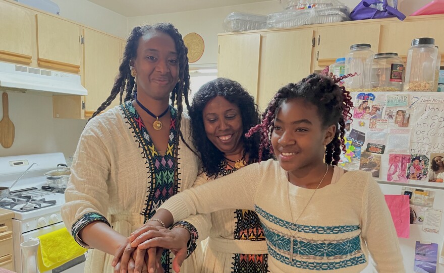 Members of the Giday family working together to prepare dinner, June 1, 2023.