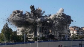 Smoke rises after an Israeli airstrike hits a building near the airport road in Beirut, Lebanon, Tuesday.