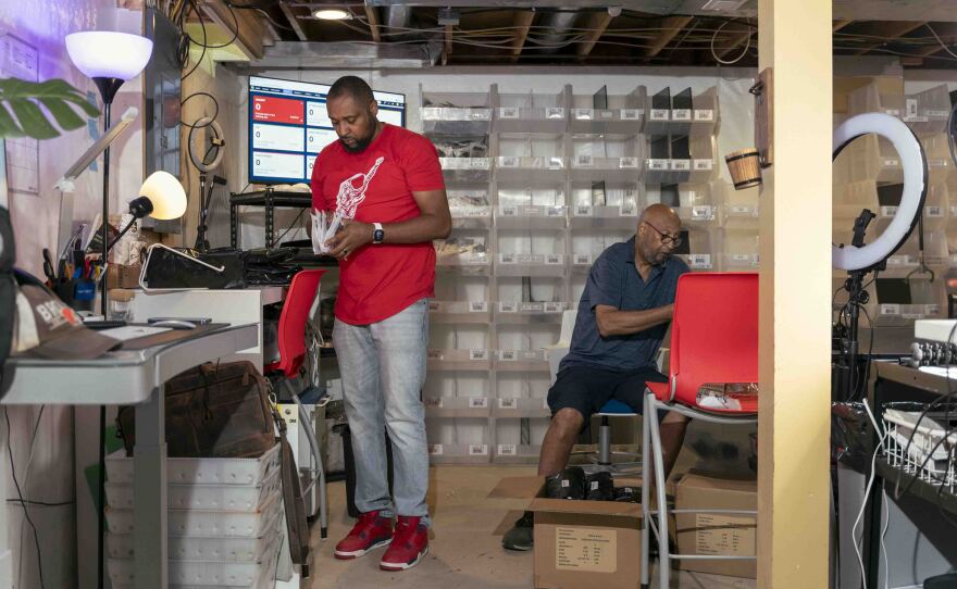 Richard Brown (left) and his father, Richard Sr., who occasionally helps out with the business, pack orders together.
