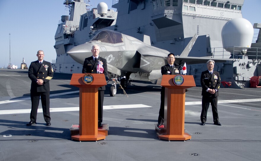 Vice Adm. John Wade, the commander of U.S. 3rd Fleet and Vice Adm. Goka Yoshihiro, the commander of Japan's Fleet Escort Force, stand at podiums. Nov. 6, 2024.