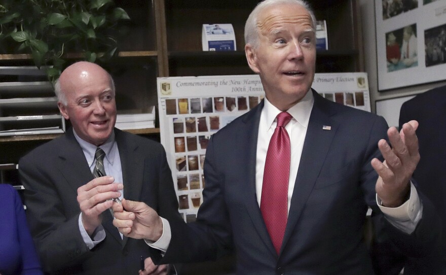 New Hampshire Secretary of State Bill Gardner, left, takes a pen from then-presidential candidate Joe Biden after he filed to have his name listed on the New Hampshire primary ballot on Nov. 8, 2019.