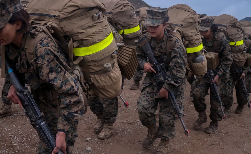 Marine recruits carrying their full gear and rifle during the Crucible, the last challenge before becoming Marines, April 22, 2021.