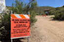A heat advisory sign warns people to keep their pets off the trail at Cowles Mountain, June 10, 2019. 
