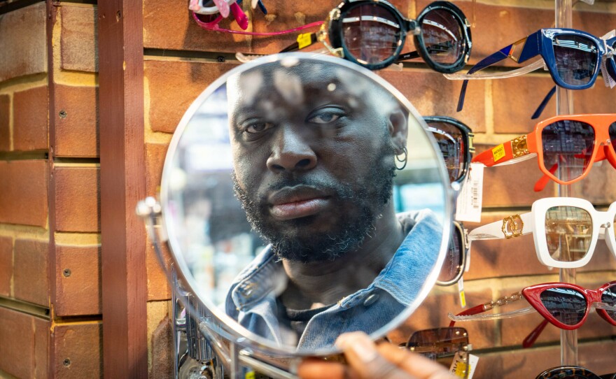 Bob looks in the mirror at Manhattan Beauty.