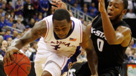 Kansas guard Sherron Collins (4) drives past Kansas State guard Jacob Pullen during the first half of an NCAA college basketball game at the Big 12 tournament Saturday in Kansas City, Mo.