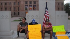 Activists gathered at the capitol on Wednesday in protest of Brewer's executive order.