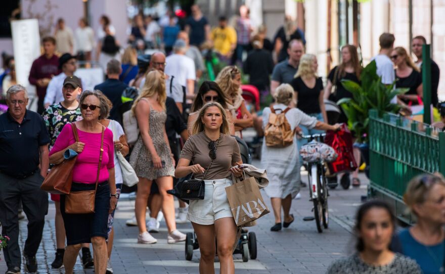 People walk in Stockholm on July 27, most without the face masks that have become common on the streets of many other countries as a method of fighting the spread of the coronavirus.