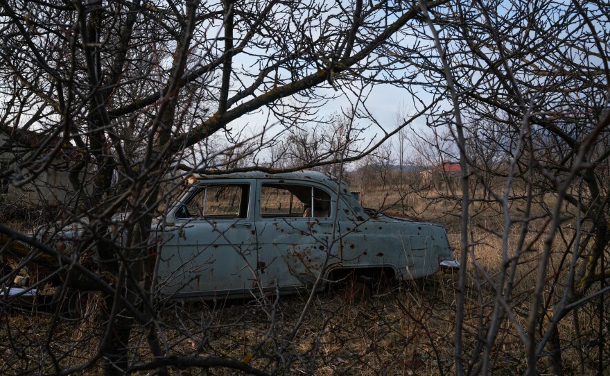 An abandoned car is riddled with bullet holes that locals say were made in the 2008 war between Georgia and Russia.