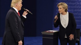 Donald Trump and Hillary Clinton speak during the second presidential debate at Washington University in St. Louis on Oct. 9, 2016.