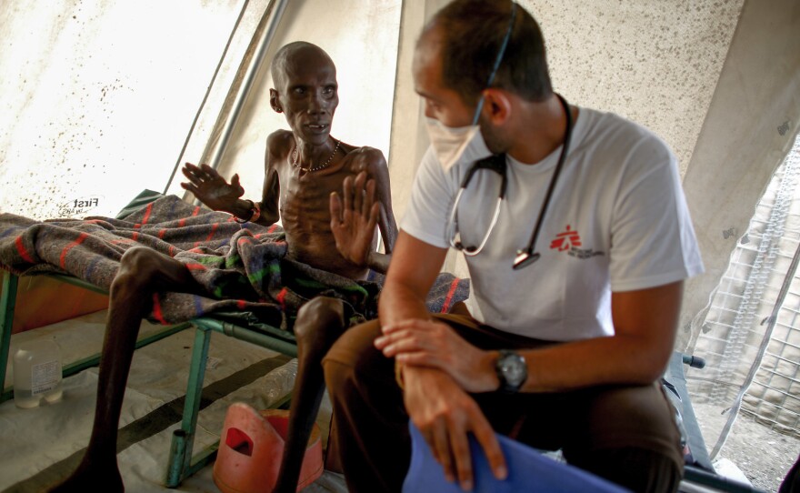 Dr. Nav talks with a tuberculosis patient.