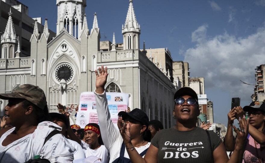 Members of several evangelical churches take part in a demonstration called by different religious groups "in defense of the traditional family" and against same-sex marriage in Caracas on July 13, 2023.