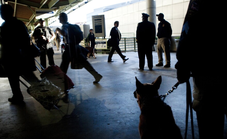 An Amtrak Police K-9 watches while commuters depart for rush hour during "Operation Railsafe" at Union Station in Washington, D.C., last October.