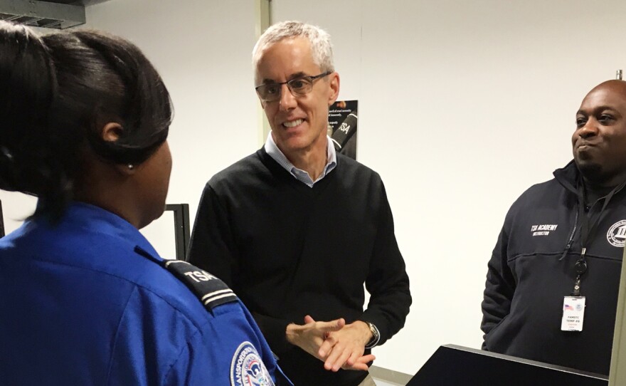 TSA Administrator Peter Neffenger (center) speaks with two academy instructors.