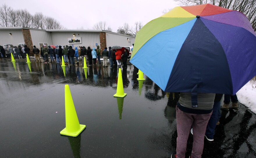 The rain didn't stop customers from lining up outside Cultivate in Leicester, Mass., on Tuesday — the first day that sales of recreational marijuana became legal in the state.