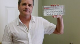 Troy Jones, who runs NukePills.com, holds a package of potassium iodide pills. Jones brokered a $1 million deal with the Ministry of Health in Kuwait earlier this year.