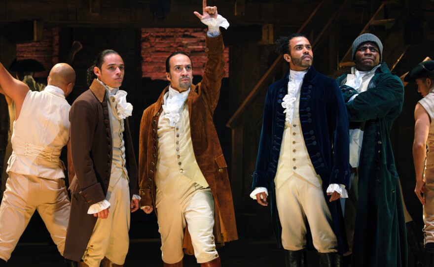 John Laurens (Anthony Ramos), Alexander Hamilton (Lin-Manuel Miranda), the Marquis de Lafayette (Daveed Diggs) and Hercules Mulligan (Okieriete Onaodowan) in the filmed version of the original Broadway production of <em>Hamilton.</em>