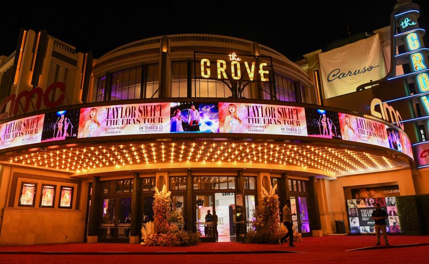 <em>Taylor Swift: The Eras Tour</em> is wildly entertaining but it is also a curious product that speaks to the larger themes of our IP-based age of content — recycled, reused and repackaged spin-offs. Above, AMC The Grove in Los Angeles, Calif., ahead of the film's world premiere on Oct. 11, 2023.
