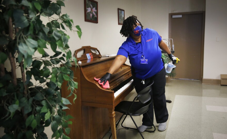 Little spends much of her time wiping down surfaces, including tables, door handles, blinds, a piano; "everything that's touchable," she says.