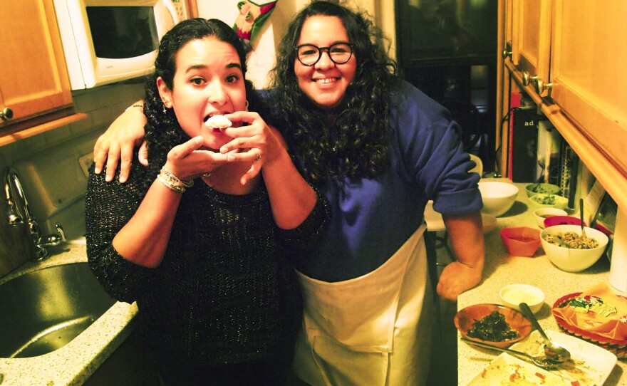 Glori Linares, left, and Victoria Delgado, invited strangers to a dinner party in their apartment in Brooklyn through the site EatWith.com.