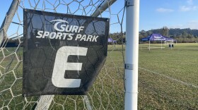 A soccer net with Surf Sports Park branding on the side of the goal sits on a manicured field, Oct. 24, 2025.