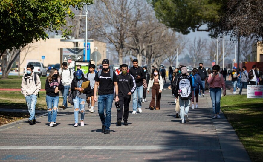 Students walk across the campus at Fresno State in Fresno on Tuesday, Feb. 8, 2022. 