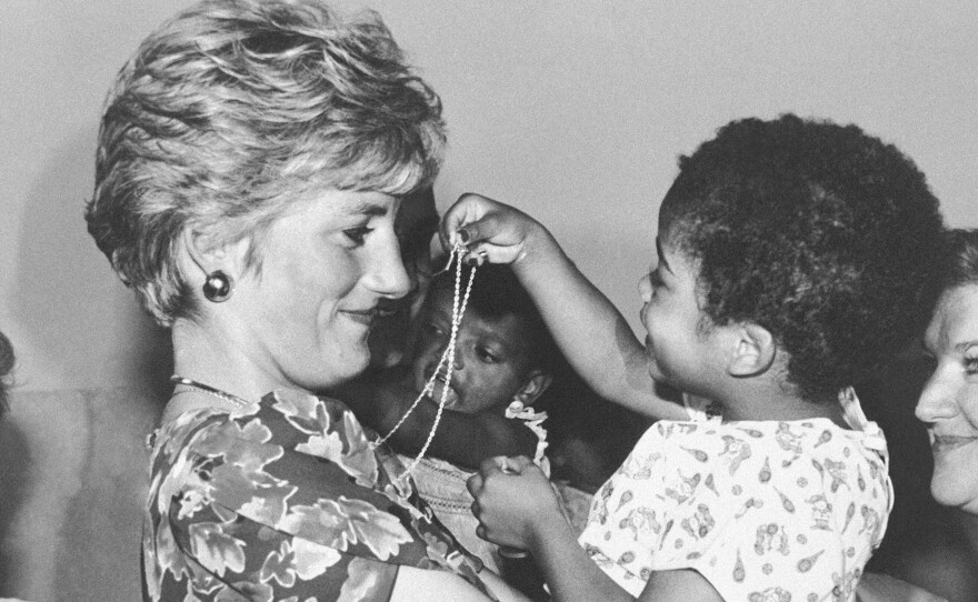 Princess Diana hugs an HIV-positive child at a hostel near Sao Paulo, Brazil, in 1991.