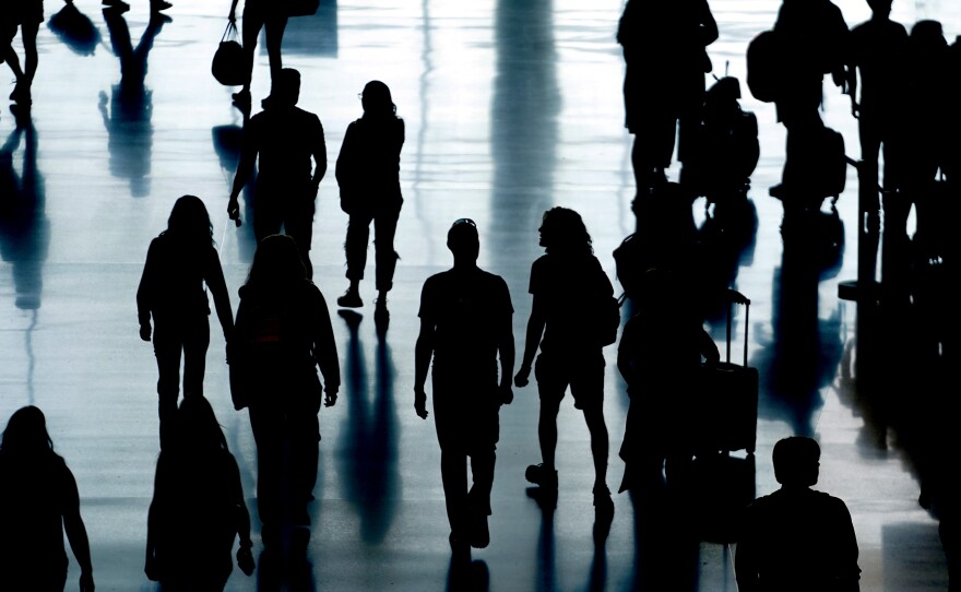 People pass through Salt Lake City International Airport Monday, June 27, 2022, in Salt Lake City.