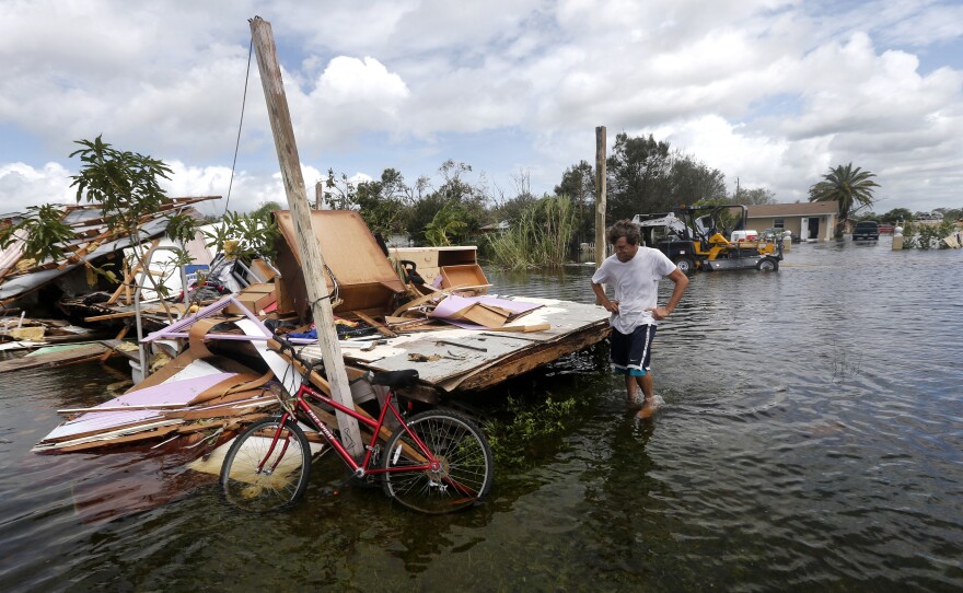 Larry Dimas walks around his destroyed trailer in the aftermath of Hurricane Irma in Immokalee, Fla., on Sept. 11, 2017. The World Meteorological Organization will no longer use Harvey, Irma, Maria and Nate to name hurricanes.