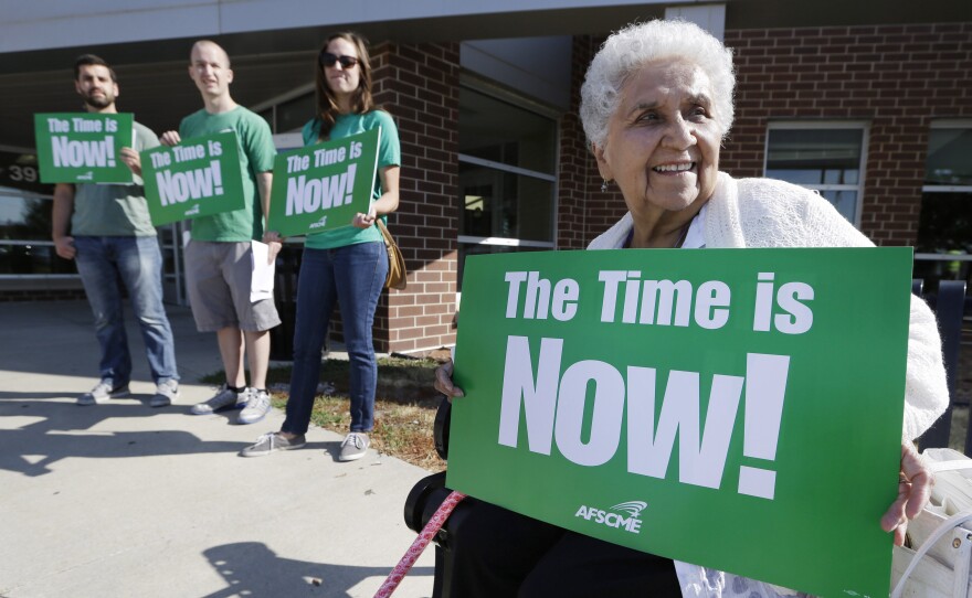 Mary Campos of Des Moines, Iowa, sits outside a forum on immigration held by senators Tom Harkin and Dick Durbin.