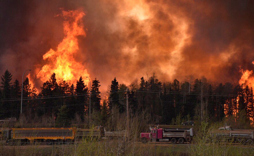 The wildfire rages along Highway 63 near Fort McMurray, Alberta, Canada, on Tuesday.