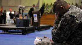 A soldier mourns at a memorial service the 2nd Infantry Division held at Camp Casey on Nov. 26.