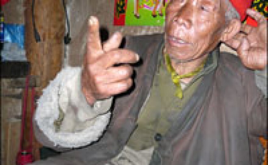 Village elder Anni Zhilei tells legends that blame the arrival of outsiders for the glacier's retreat.