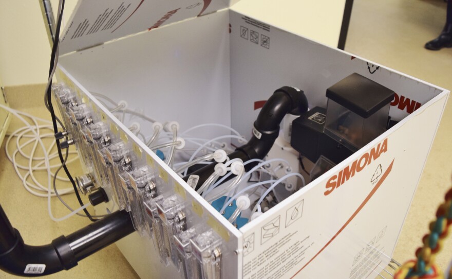 An air pump controlled by a computer creates a mixture of scents from various samples inside the olfactometer.