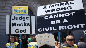 Opponents of same-sex hold signs outside of San Francisco city hall after a decision to lift a stay on same-sex marriages was announced August 12, 2010 in San Francisco, California.